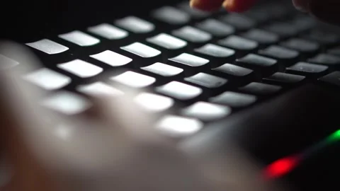 Typing on backlit keyboard in dark Stock Footage 277144495