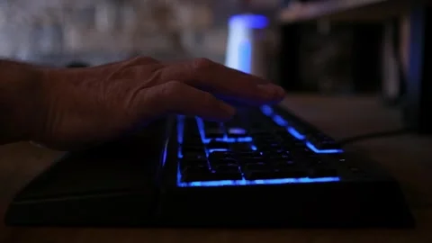 Typing on a backlit keyboard Video stock 241838878