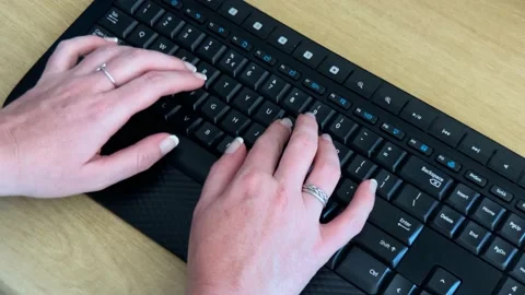 Typing on a black keyboard. Stock Footage 170140521