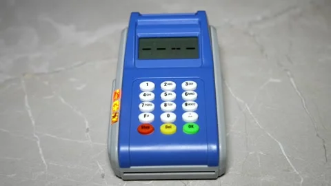 Typing on Blue Payment Terminal Stockbeeldmateriaal 320529362
