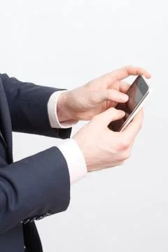 Typing on cell phone Stock Photos