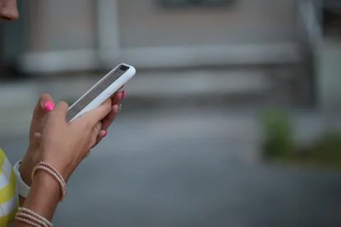 Typing on a cell phone Stock Photos