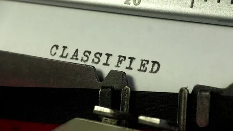 Typing Classified on a secret document with an old manual typewriter. Stock Footage 234702349