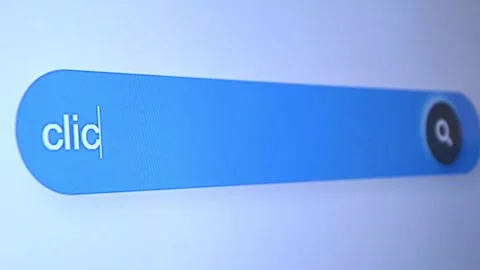 Typing "clickbait" in search bar, misleading headlines and internet content Stock Footage 315126855