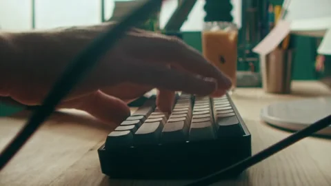 Typing Close Up on a Mechanical Keyboard in a Modern Bright Home Office Space Stock Footage 331098904