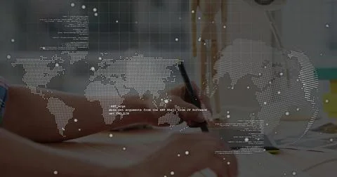 Typing code with developer forearms holding pen writing in notebook on office 写真素材