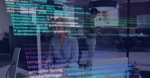 Typing code middle-aged female developer in blouse at office with desktop 스톡 사진