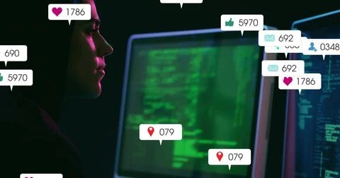 Typing coder at office desk with monitors displaying code, floating notification Foto stock
