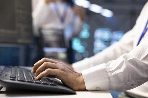 Typing, coding and keyboard in server room for programming, close up 写真素材