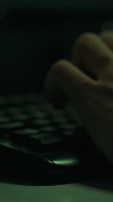 Typing on computer keyboard in a dimly lit environment at night Stock Footage 331732169