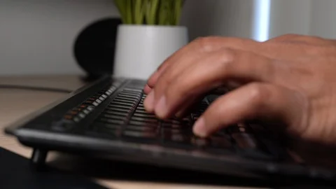 Typing on a computer keyboard Stock-Footage 102509101