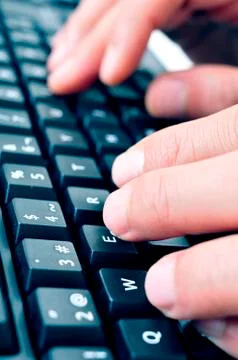 Typing on a computer keyboard Stock Photos