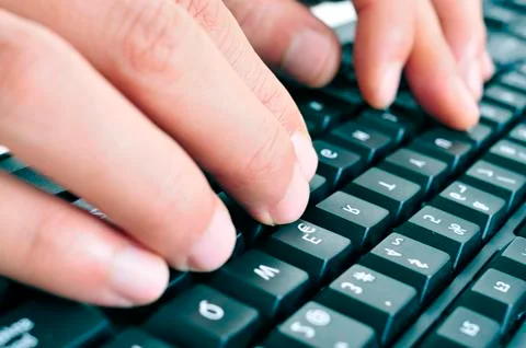 Typing on a computer keyboard Stock Photos