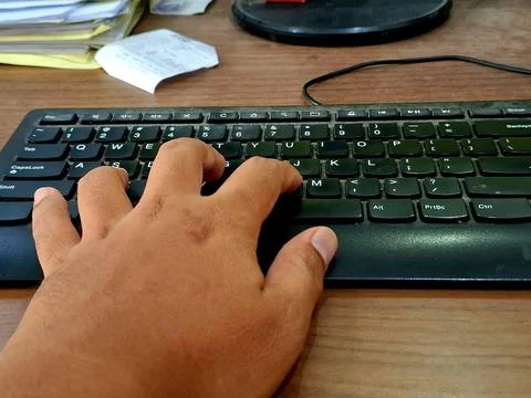 Typing on a computer keyboard Stock Photos