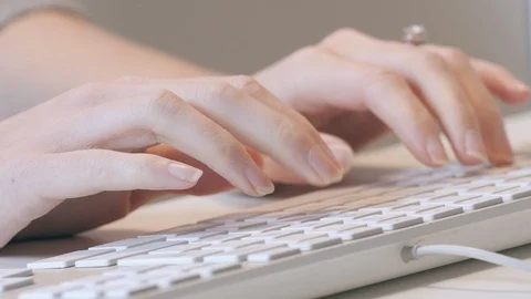  Typing on Computer Keyboard Woman Writer Secretary Closeup Tracking right Stock Footage 102848403
