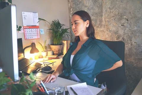 Typing, computer or woman with back pain in home office for bad posture, editing Stock Photos