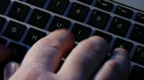 Typing on computer, overhead rotation zoom out Video stock 48584164