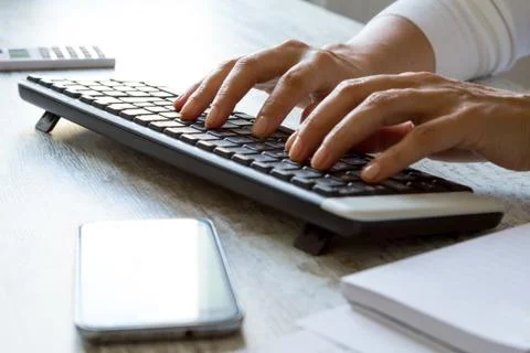 Typing on the computer Stock Photos