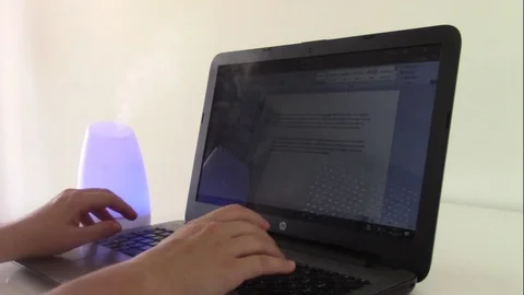 Typing on the computer with serenity Stock Footage 83864285