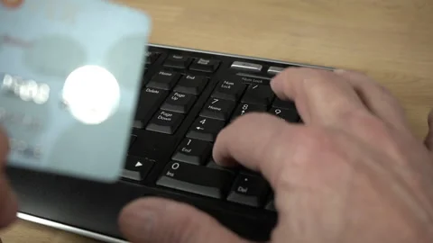 Typing a credit card number while shopping online Stock Footage 235862600