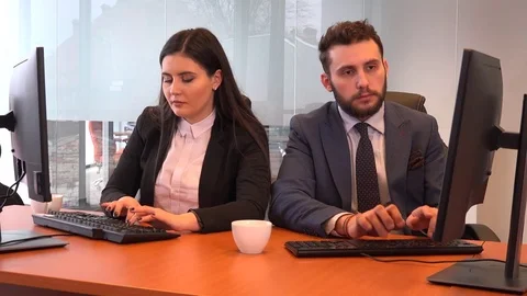 Typing desktop computer businessman disturb young businesswoman success teamwork Stock Footage 84316216