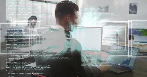 Typing developer wearing dark T-shirt writing code on laptop at wooden desk,  写真素材