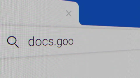 Typing for "docs.google.com" in an Internet Search Engine on a Computer Stock Footage 314812056