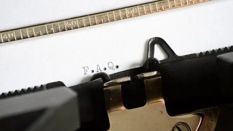 Typing the expression F.A.Q. with an old manual typewriter Video stock 72667054
