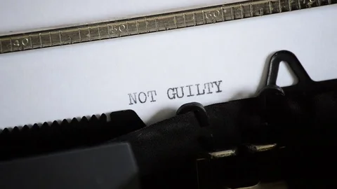 Typing the expression NOT GUILTY with an old manual typewriter 스톡 동영상 72692143