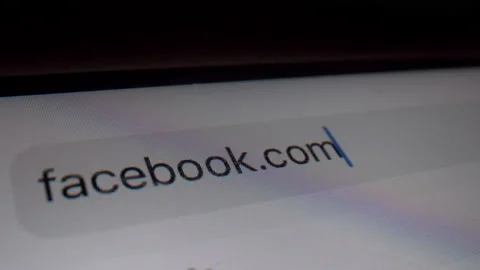 Typing Facebook domain in browser bar - Macro Stock Footage 145644584