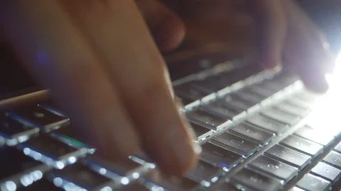 Typing with fingers on modern Laptop Computer at night in Slow Motion with li Stock-Footage 124703879