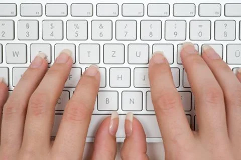 Typing on a Grey Keyboard Foto stock