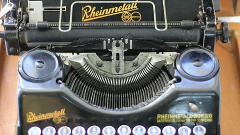 Typing by hand on an old typewriter Stock Footage 118984759