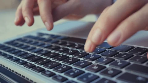 Typing hands on laptop keyboard Video stock 128808433