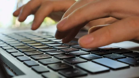 Typing hands on laptop keyboard Stock Footage 129006460