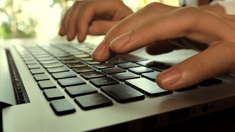 Typing hands on laptop keyboard Stock Footage 129006532