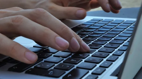 Typing hands on laptop keyboard Stock Footage 129323041