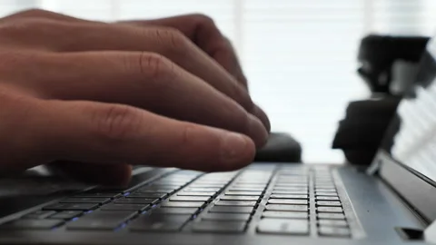 Typing hands on laptop keyboard Stock Footage 150863244