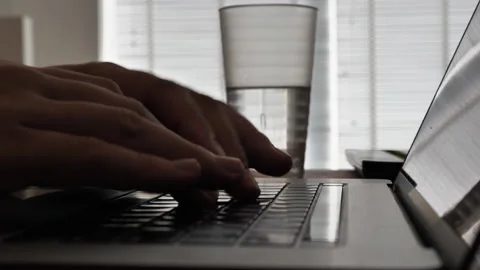 Typing hands on laptop keyboard Stock Footage 150863475