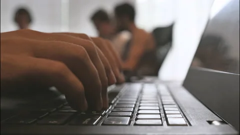 Typing hands on laptop keyboard Stock Footage 172035734