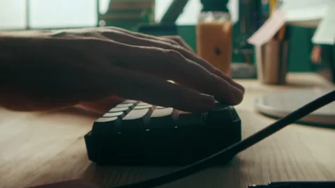 Typing Hands on a Mechanical Keyboard in a Home Office Workspace 库存影片 331099013