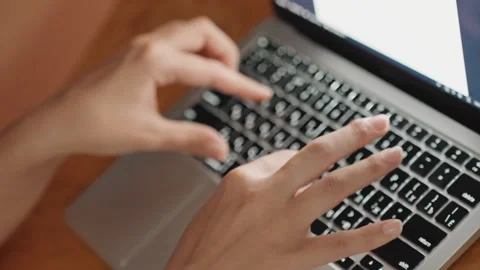 Typing hands on modern laptop at workspace. Individual typing on stylish laptop Stock Footage 330534931
