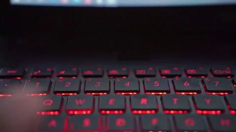Typing hands on number laptop keyboard with LED lighting, programming and 스톡 동영상 334394767