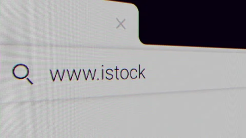 Typing for "istockphoto.com" in an Internet Search Engine on a Computer Stock Footage 314812050