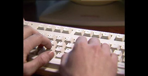 Typing on a Keyboard and Using a Mouse (1999) Stock Footage 310169732