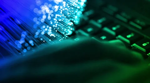 Typing on keyboard with Fiber optics background, shot in HD Stock Footage 66336016