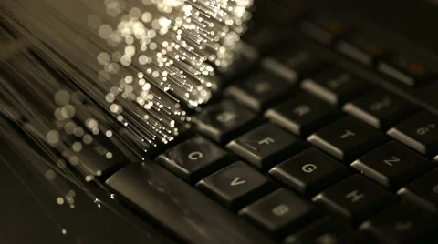 Typing on keyboard with Fiber optics background, shot in HD Stock Footage 66336579