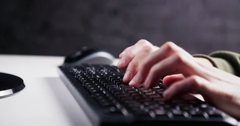 Typing on a keyboard Stockbeeldmateriaal 104224134