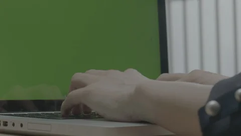 Typing keyboard with green screen computer in office Stock Footage 129069957