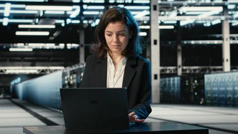 Typing on keyboard, laptop and engineer in data center Stock Photos